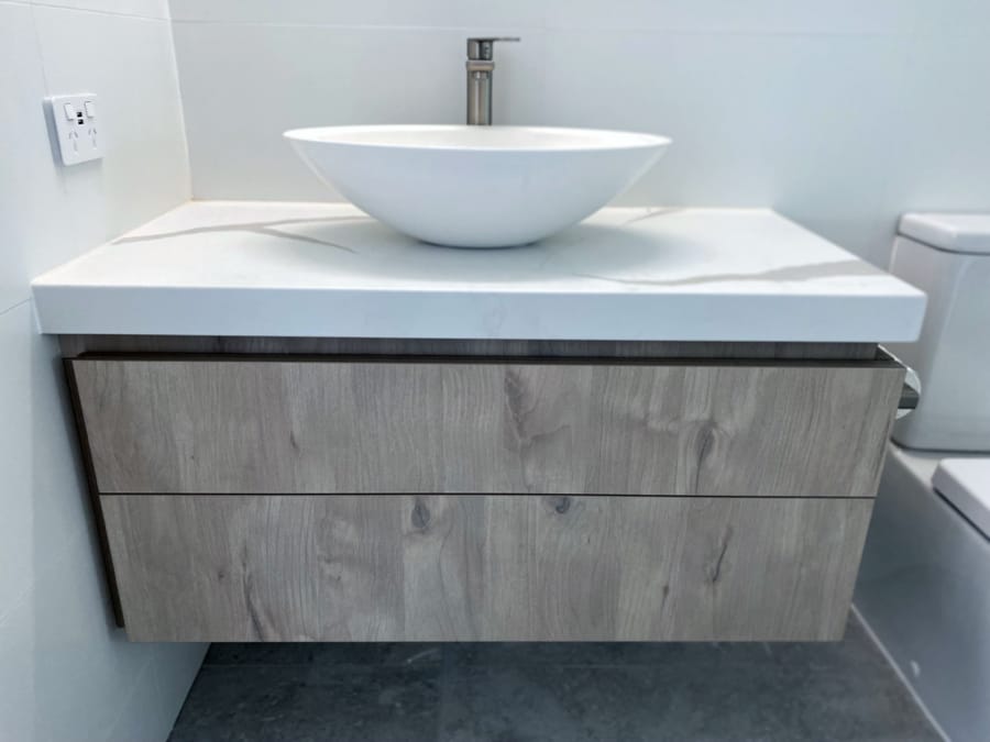 timber vanity with white stone top